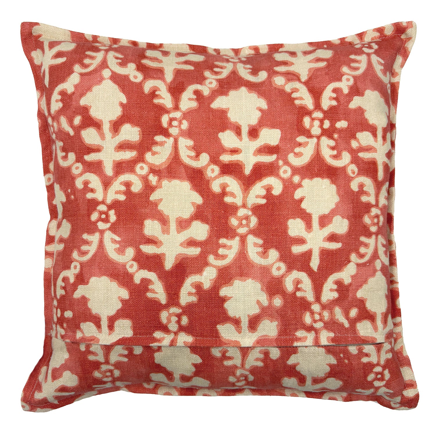 Decorative pillow with red and white floral pattern on a white background