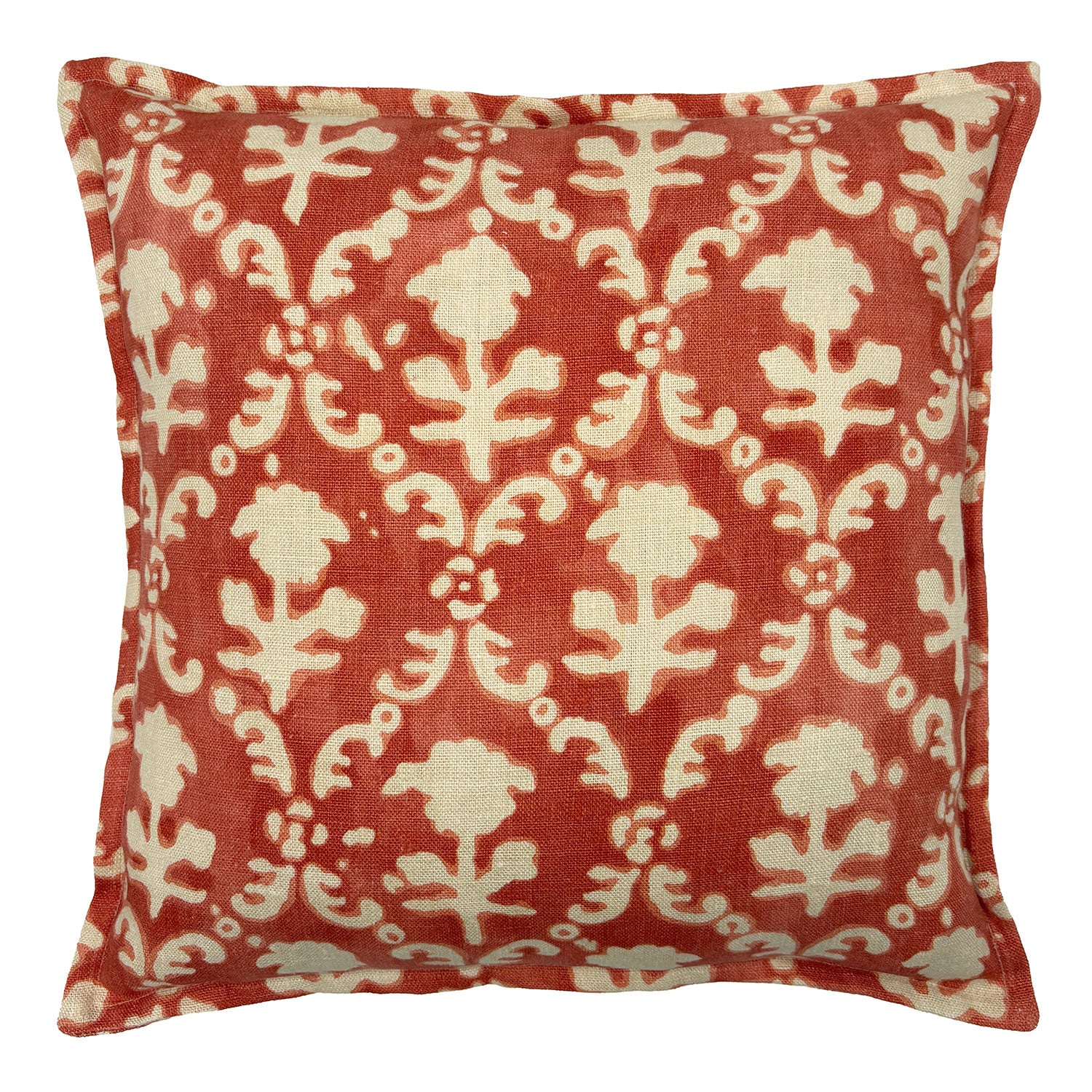 Decorative pillow with red and ivory floral pattern.