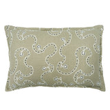 Decorative cushion with a free-flowing floral pattern on a sand coloured background.