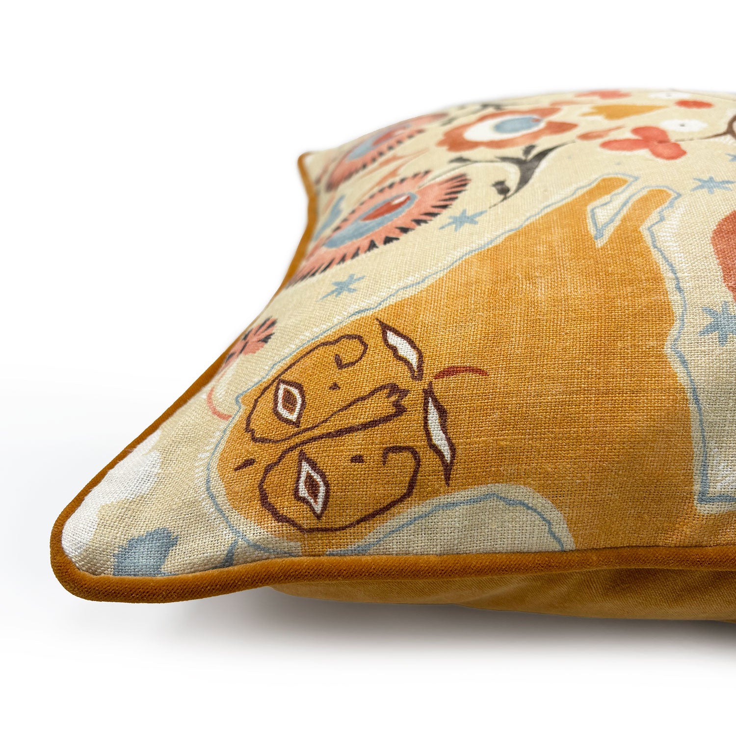 Decorative cushion with a lion design on a off-white background