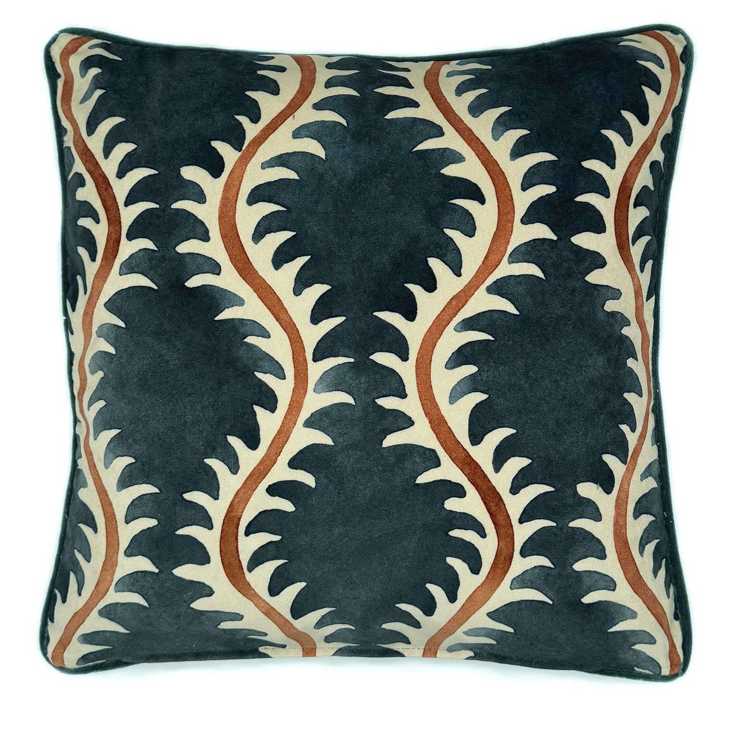 A orange, blue and off white velvet cushion with a all-over repeat pattern and velvet piping.