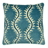 A blue and off white velvet cushion with a all-over repeat pattern and velvet piping.