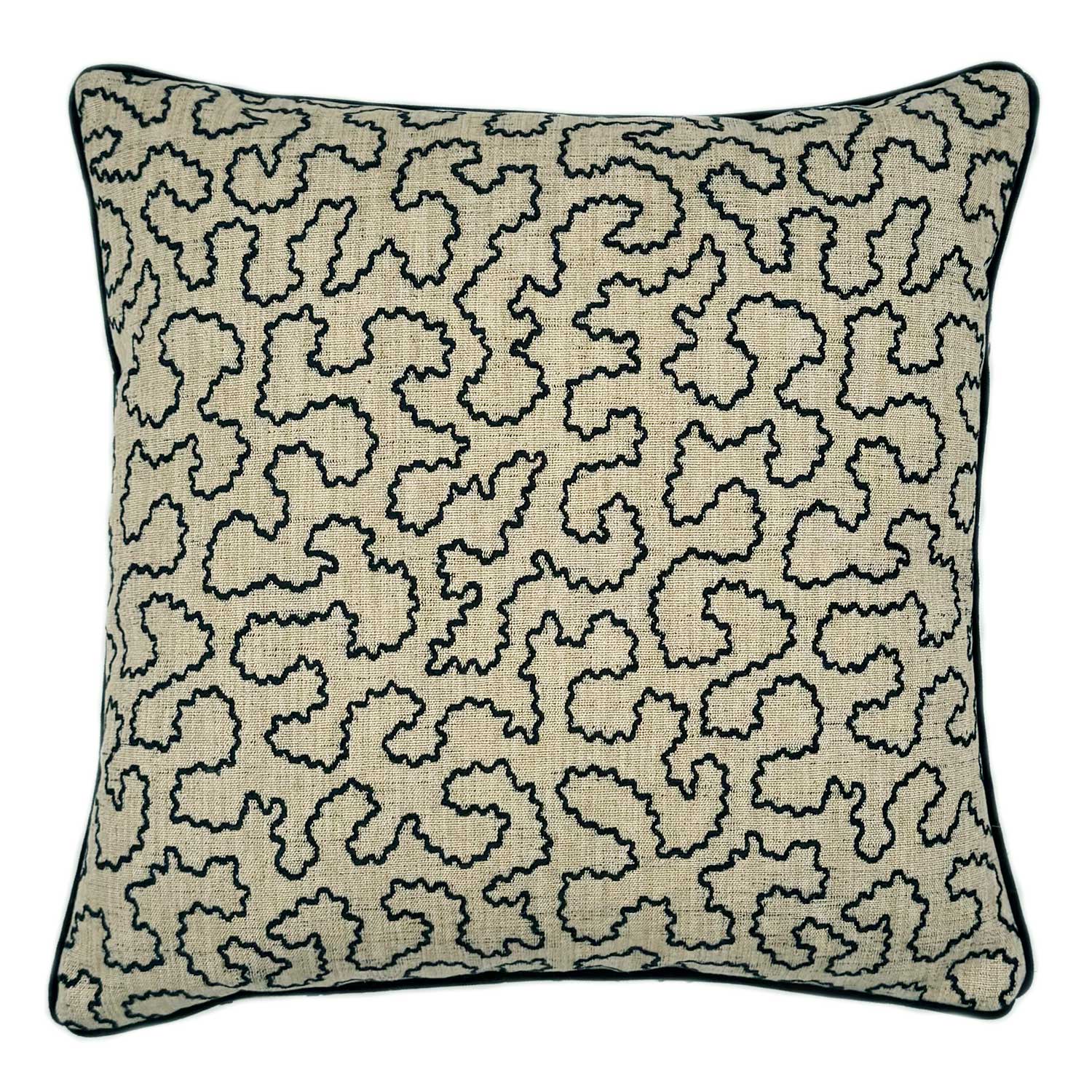 A black and off white woven cushion featuring a wavy pattern with a velvet piping.