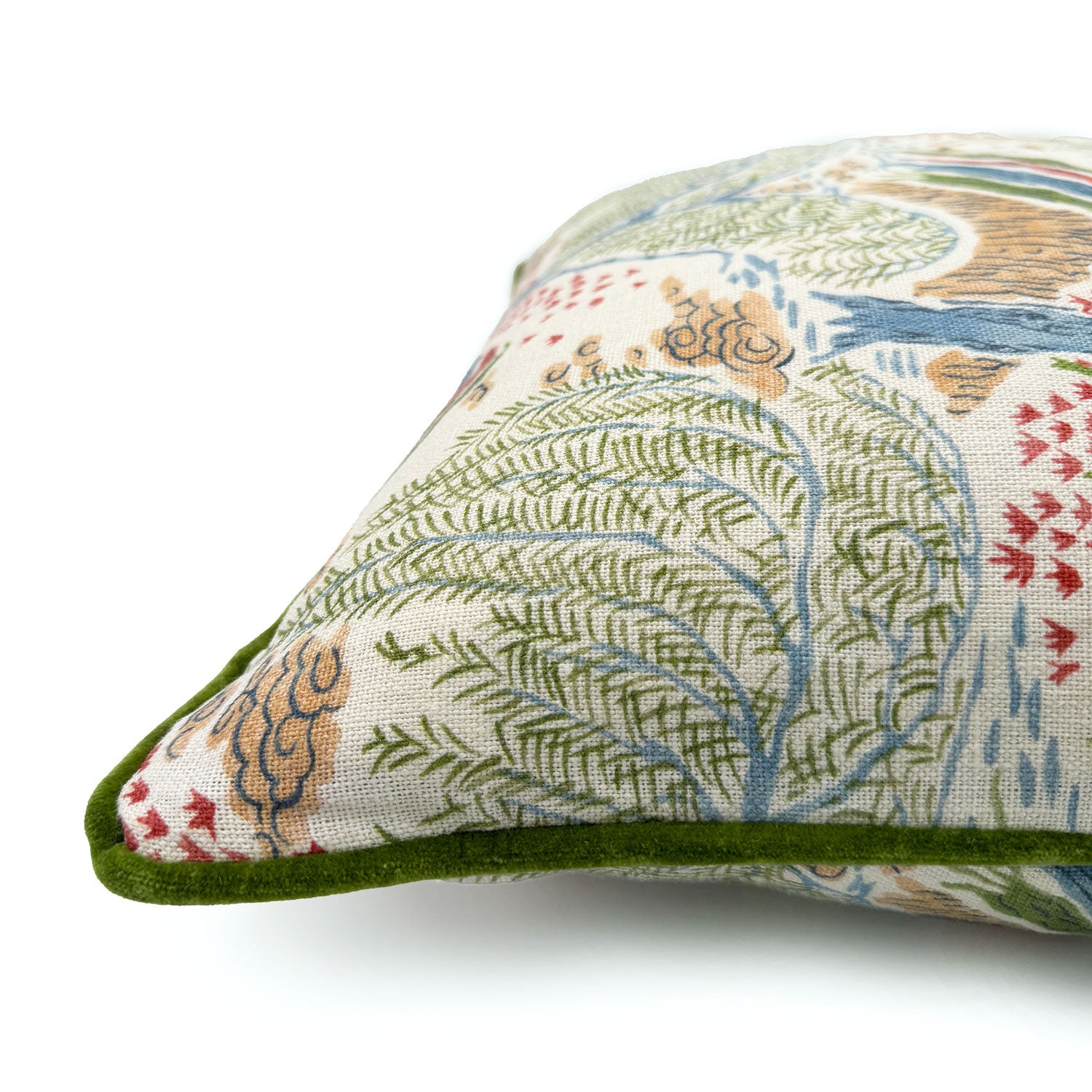 Close-up side view of Linwood cushion in Gwendolyn, Cranberry showing fabric texture and piping in a deluxe green velvet.
