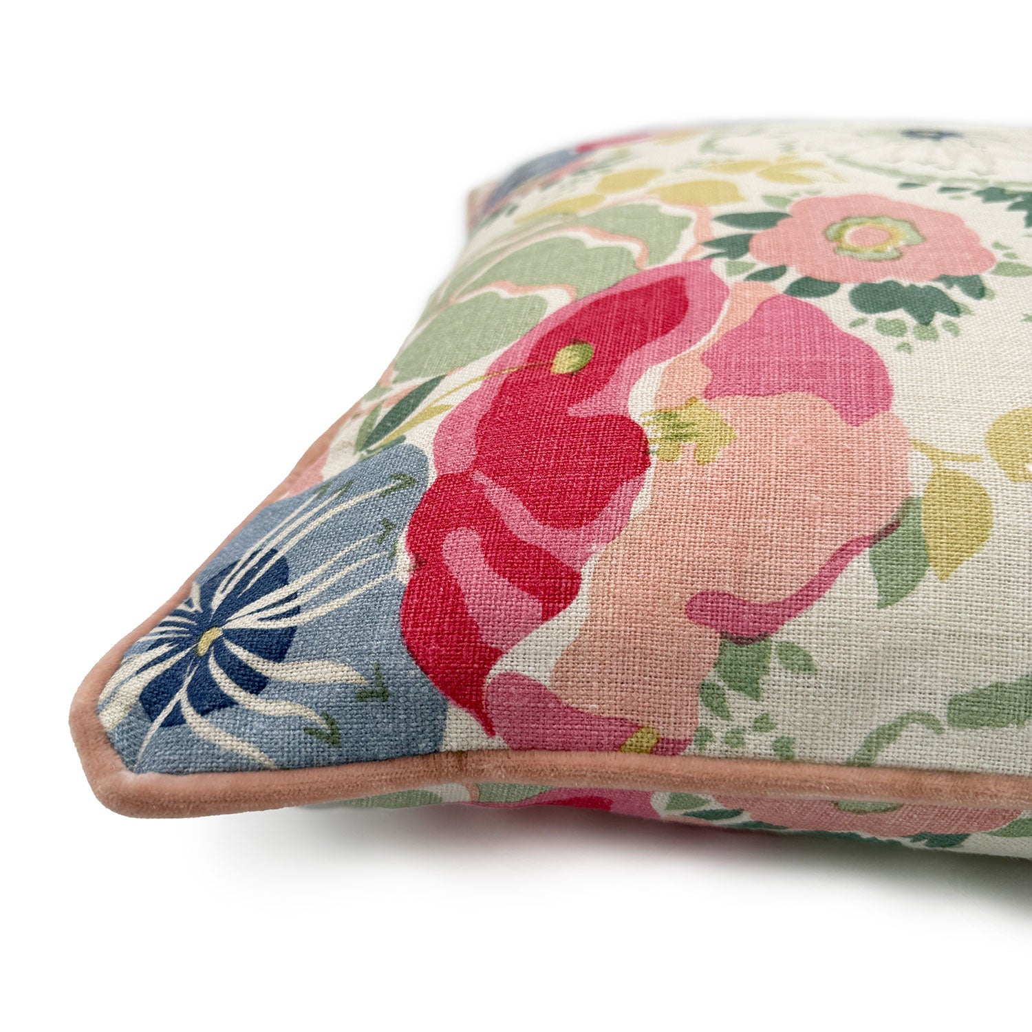 Close-up side view of Linwood cushion in Joni, Raspberry showing fabric texture and piping in a complementary soft pink linen.