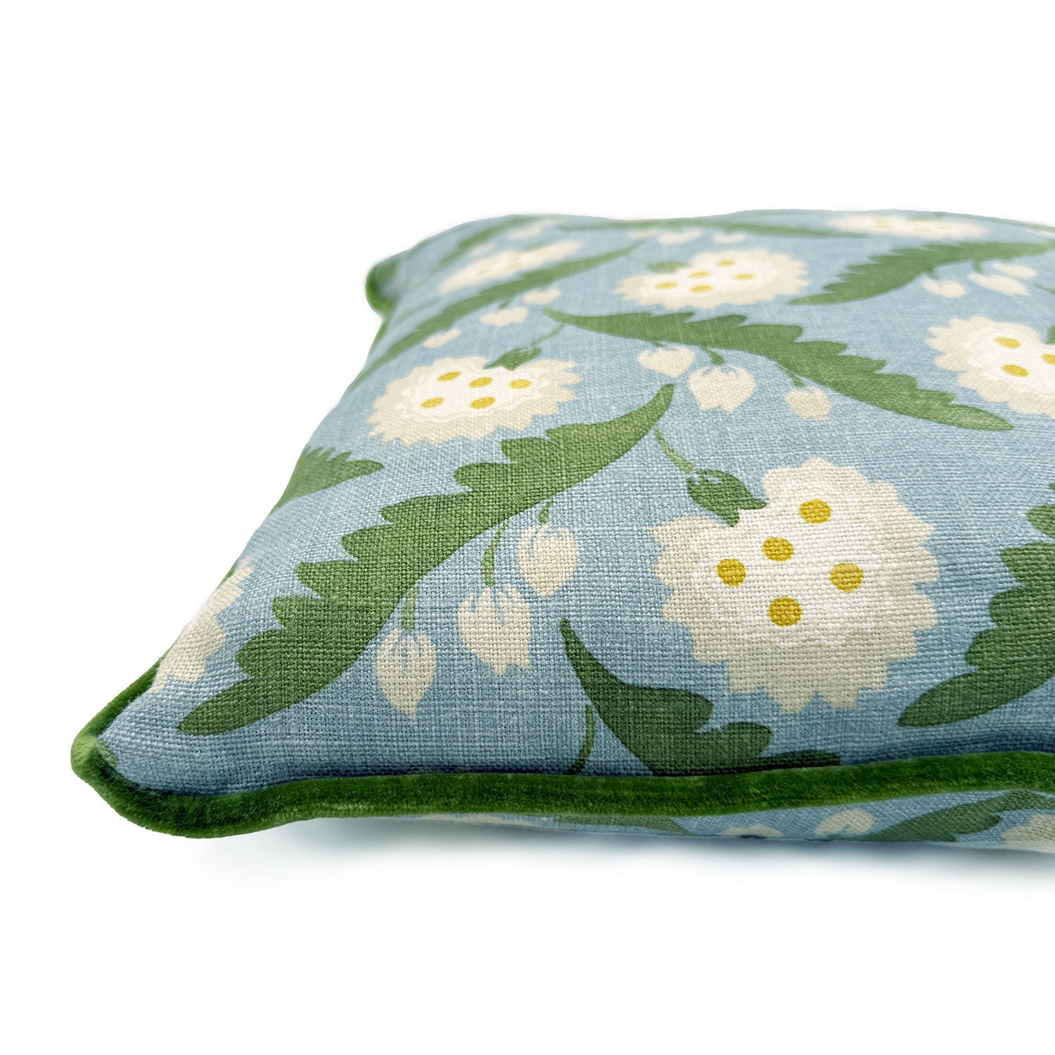Close-up side view of Linwood cushion in Polly, Lakeside showing fabric texture and piping in a luxurious green velvet.