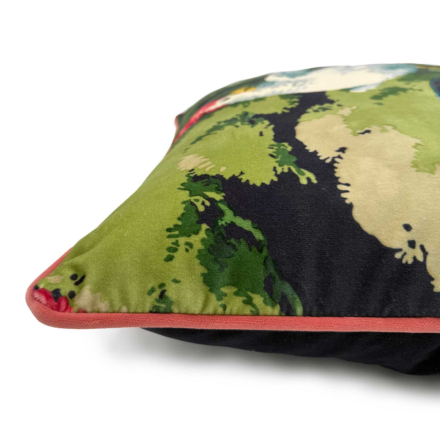 Close-up side view of Linwood cushion in Jungle Jive Navy, showing the fabric texture and contrast coral-red piping detail.