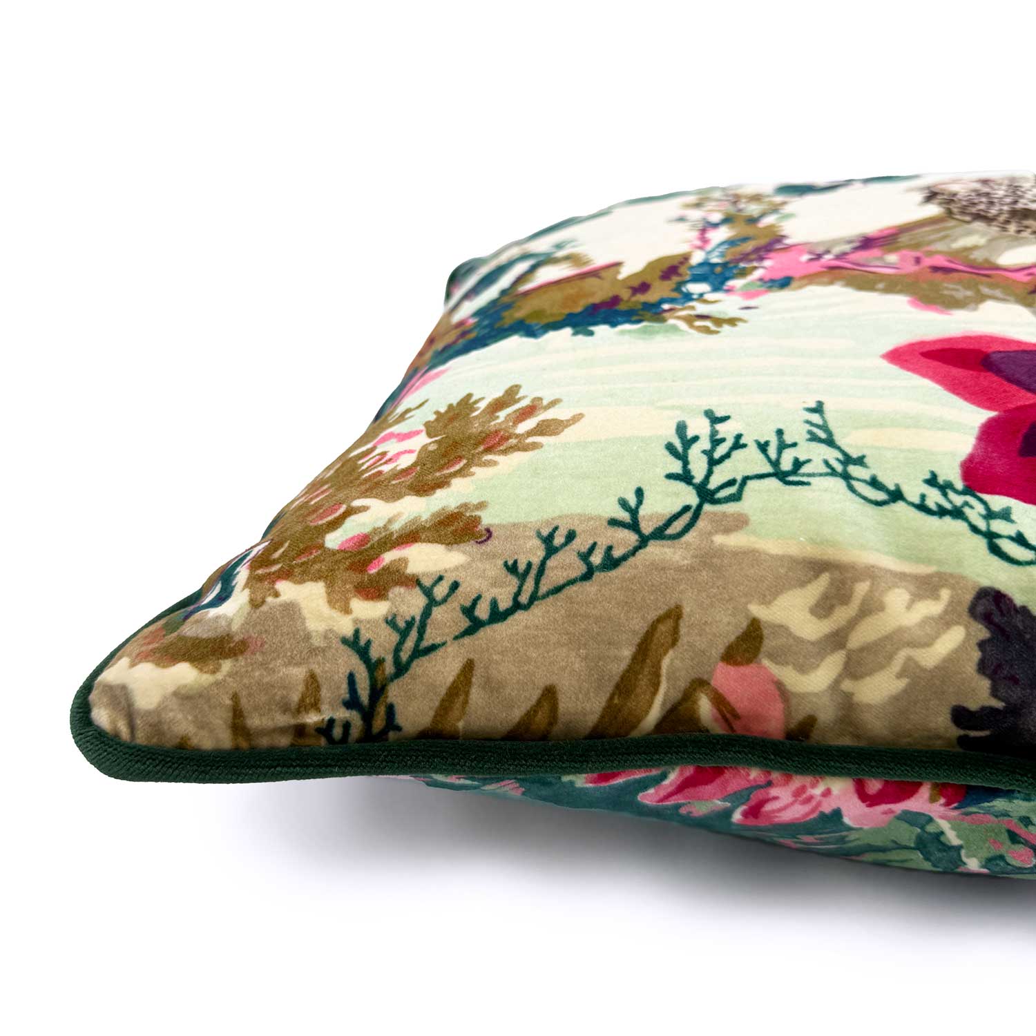 Close-up side view of Linwood cushion in Jungle Rumble Velvet Leopard, showing the fabric texture and contrast green piping detail.
