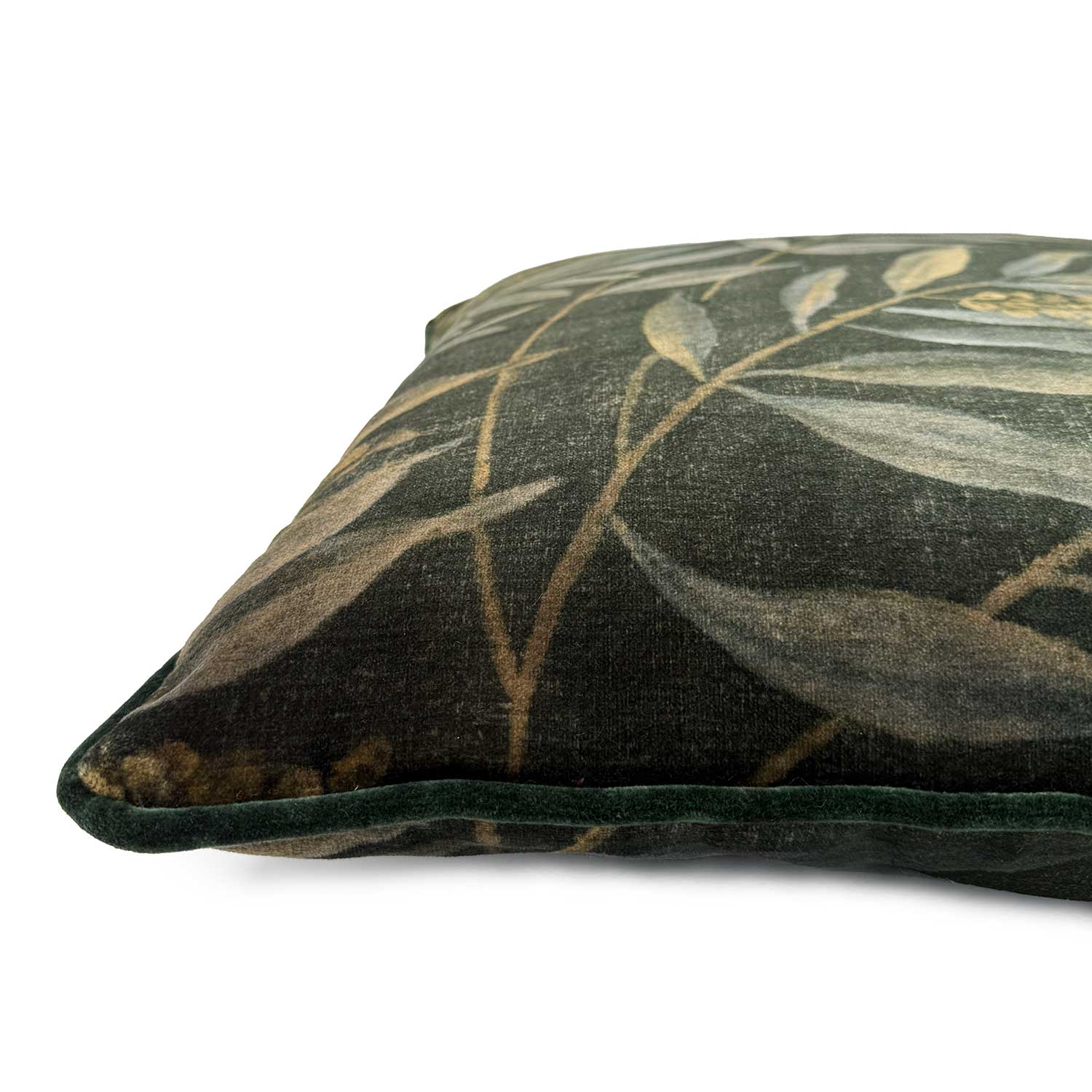 Close-up side view of Linwood cushion in Lumen Metallic, showing the contrast piping in green velvet.