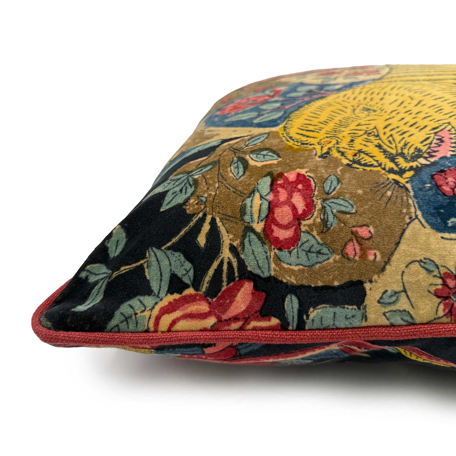 Close-up side view of Linwood cushion in Wild Midnight, showing the contrast pink piping detail.