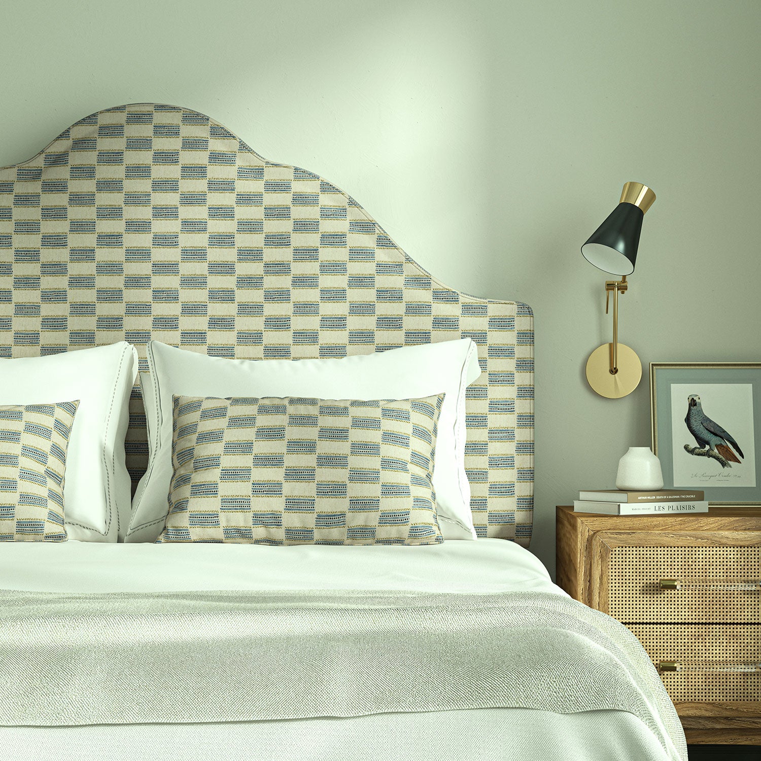 Bedroom with upholstered headboard and cushions in Tidal fabric showing soft texture.