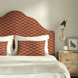 Bedroom with upholstered headboard and cushions in Strata fabric showing soft texture.