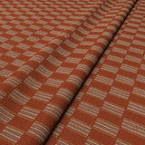 Strata fabric styled in a wave to show horizontal structure and depth.