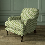 Armchair upholstered in Strata fabric highlighting horizontal texture and tonal depth.