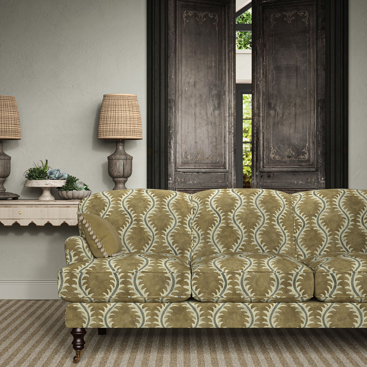 Sofa upholstered in a printed velvet fabric in brown and grey featuring a stylized fern pattern.