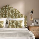 Headboard upholstered in a printed velvet fabric in brown and grey featuring a stylized fern pattern.