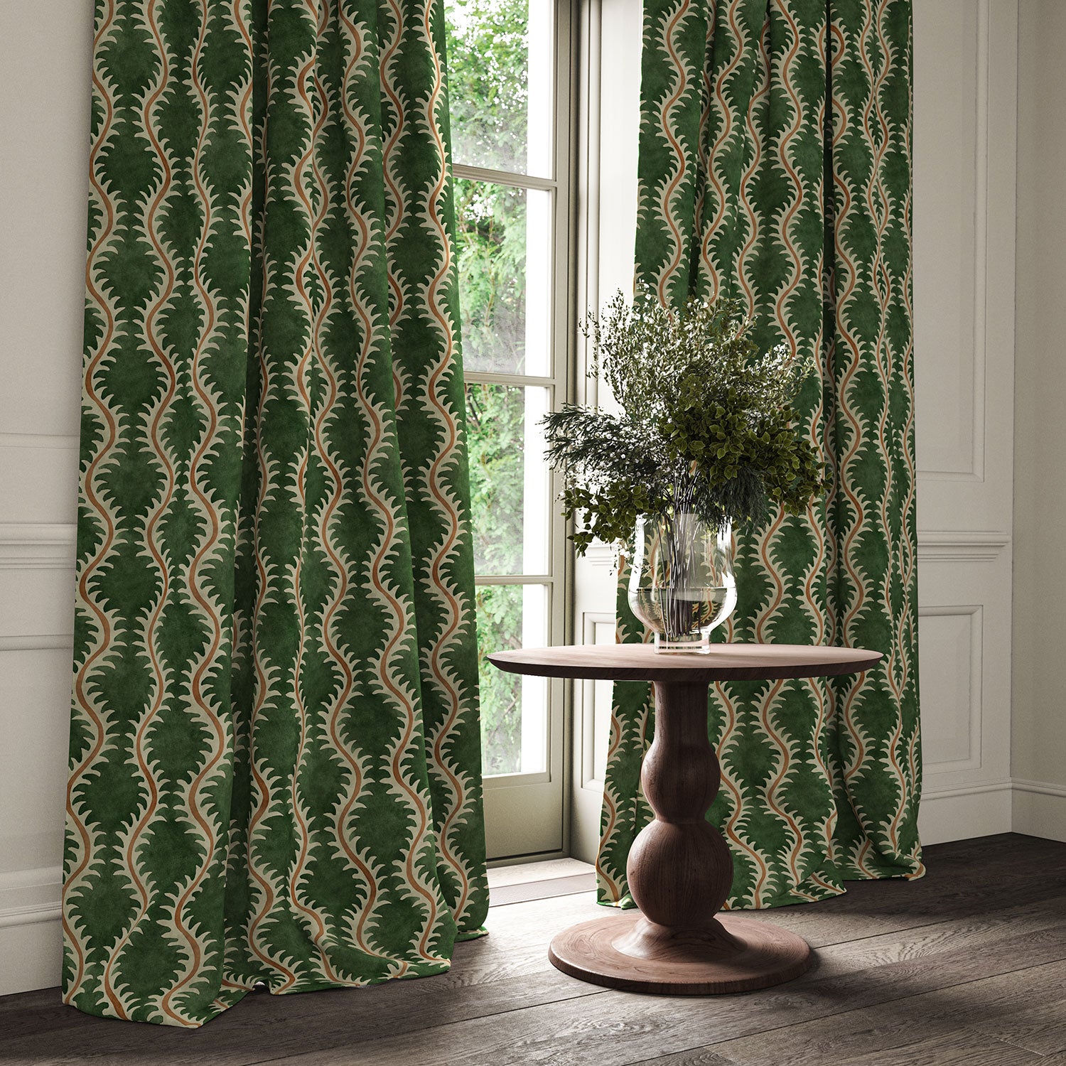 Curtains in a printed velvet fabric in green and orange featuring a stylized fern pattern.