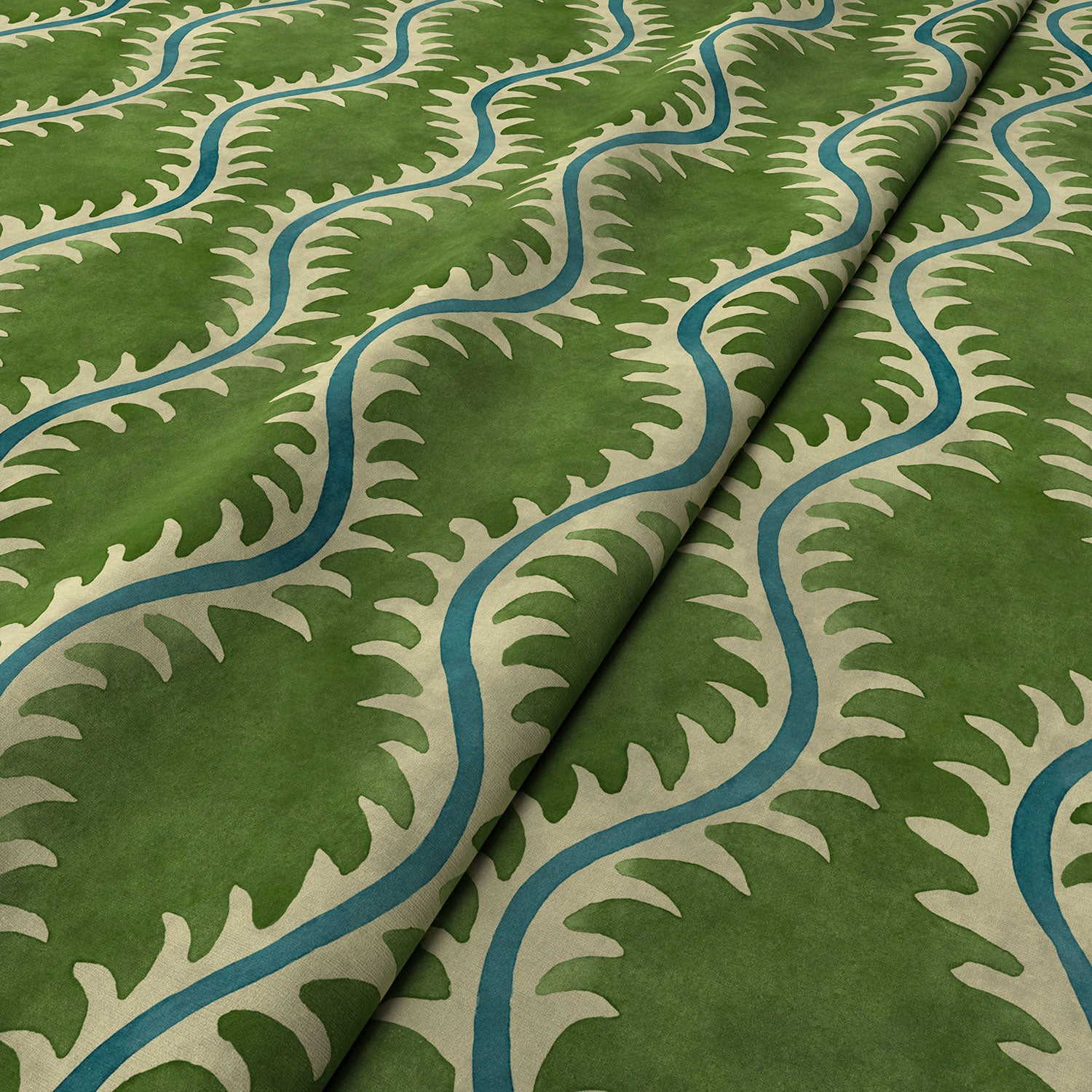 A printed velvet fabric sample in green and blue featuring a stylized fern pattern.