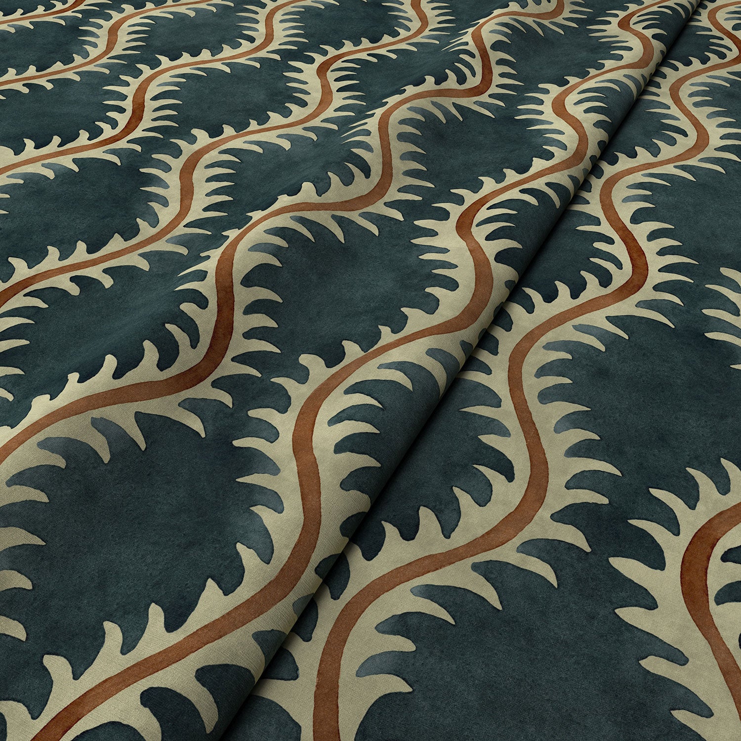 A printed velvet fabric sample in blue and orange featuring a stylized fern pattern.