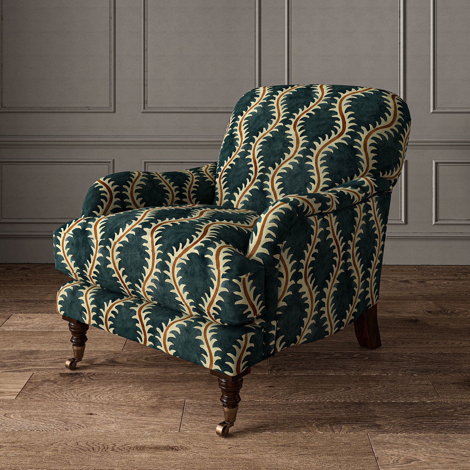 Armchair upholstered in a printed velvet fabric in blue and orange featuring a stylized fern pattern.