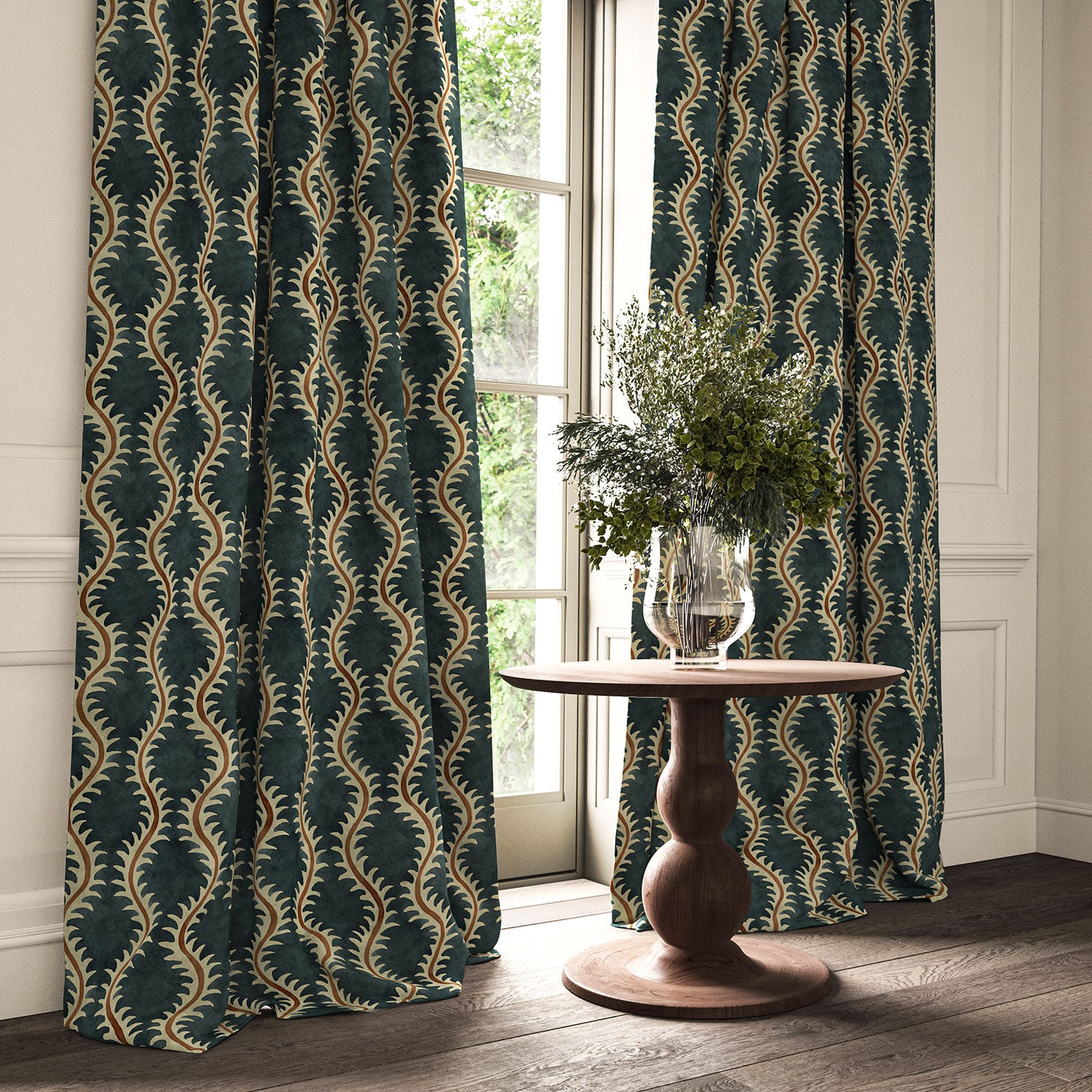 Curtains in a printed velvet fabric in blue and orange featuring a stylized fern pattern.