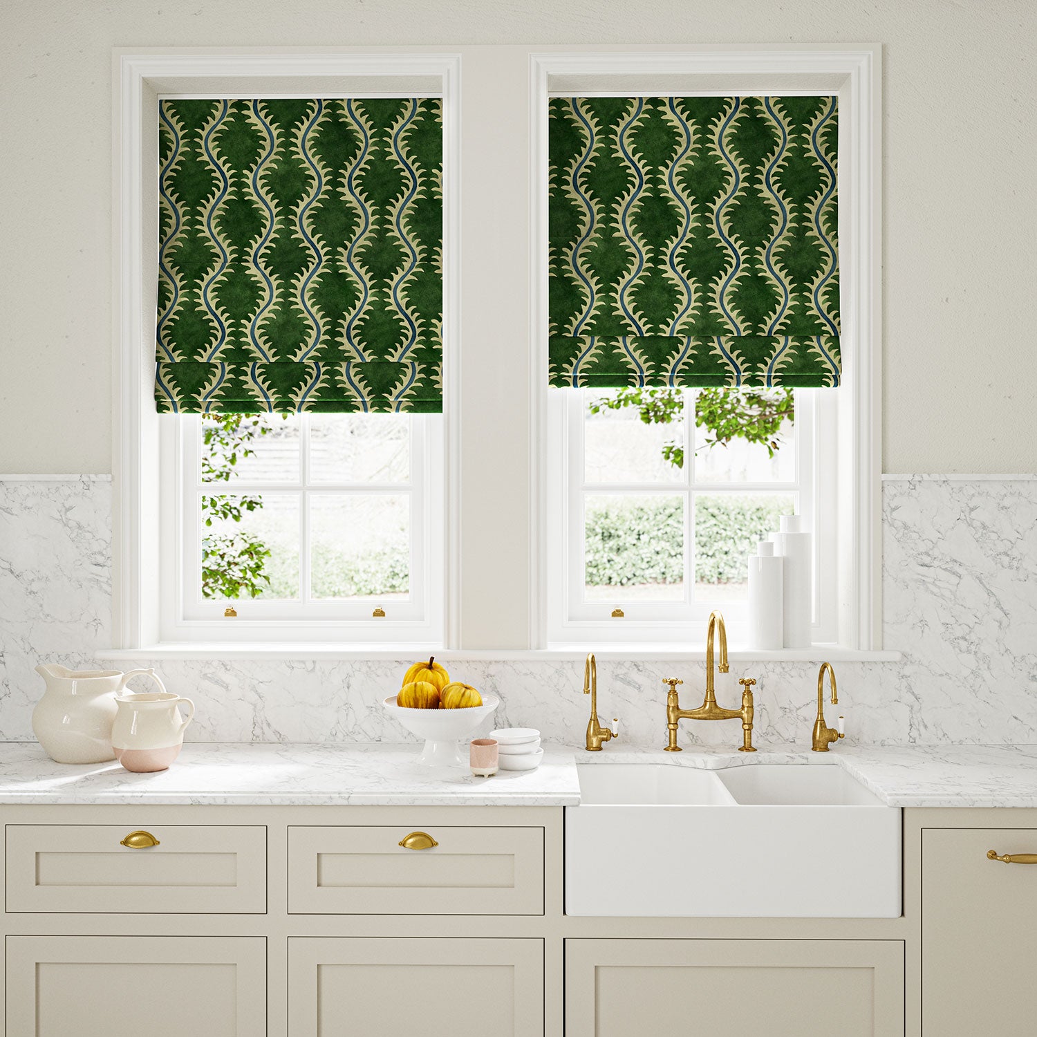 Blinds in a printed velvet fabric in green and blue featuring a stylized fern pattern.