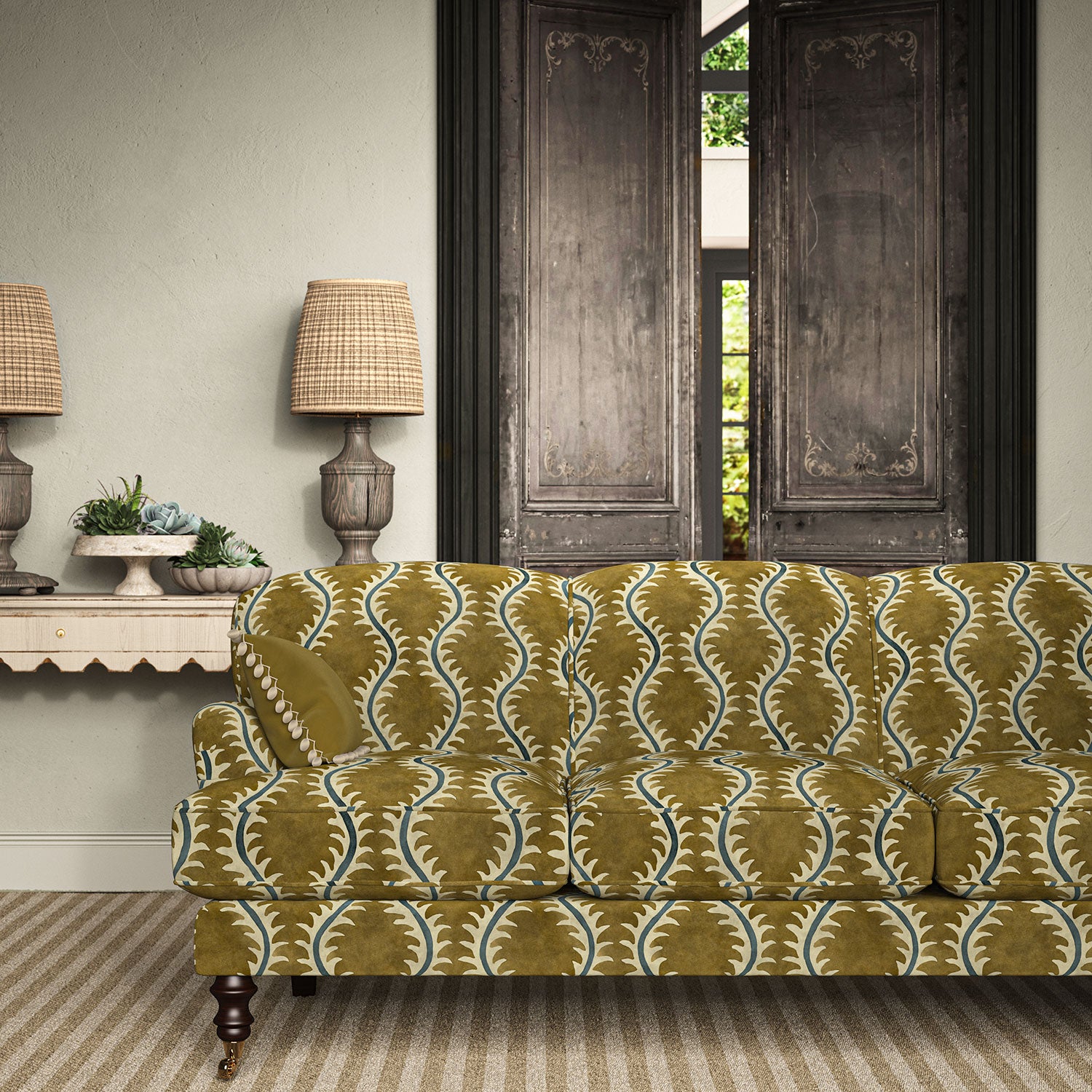 Sofa upholstered in a printed velvet fabric in brown and blue featuring a stylized fern pattern.