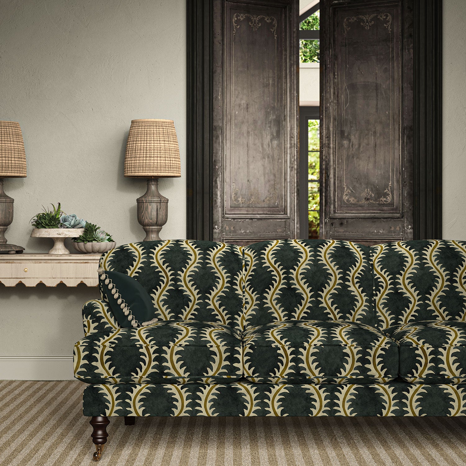 Sofa upholstered in a printed velvet fabric in blue and brown featuring a stylized fern pattern.