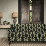 Sofa upholstered in a printed velvet fabric in blue and brown featuring a stylized fern pattern.