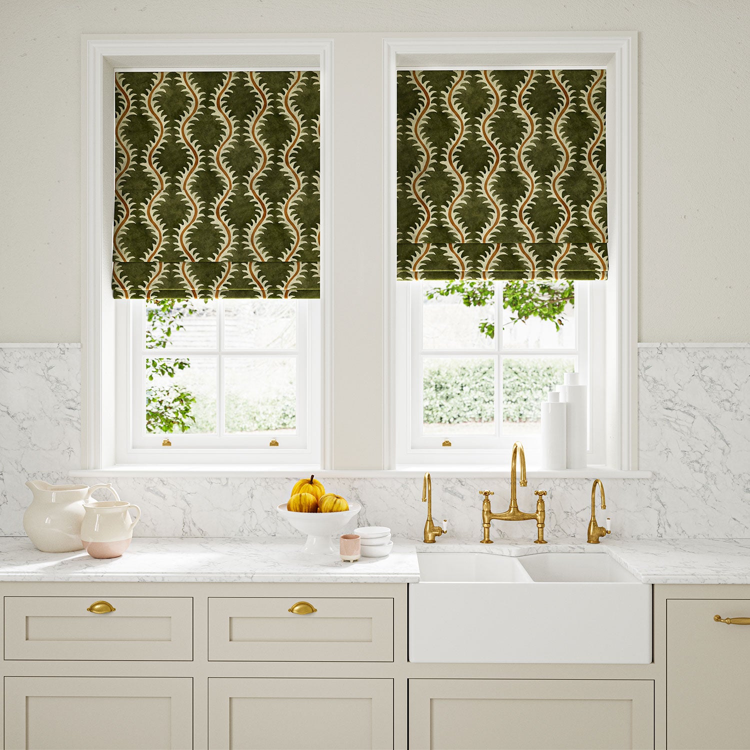 Blinds in a printed velvet fabric in green and orange featuring a stylized fern pattern.