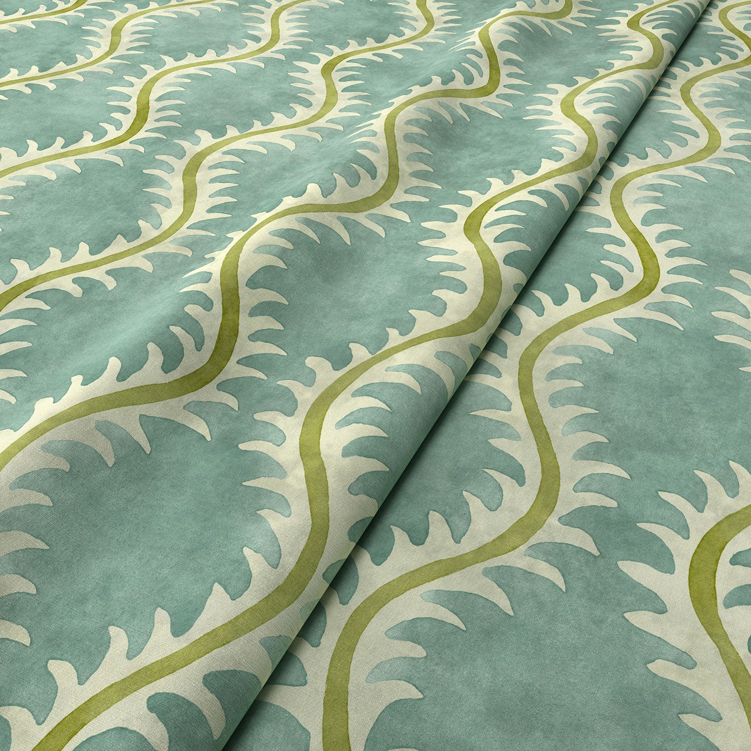 A printed velvet fabric sample in blue and green featuring a stylized fern pattern.