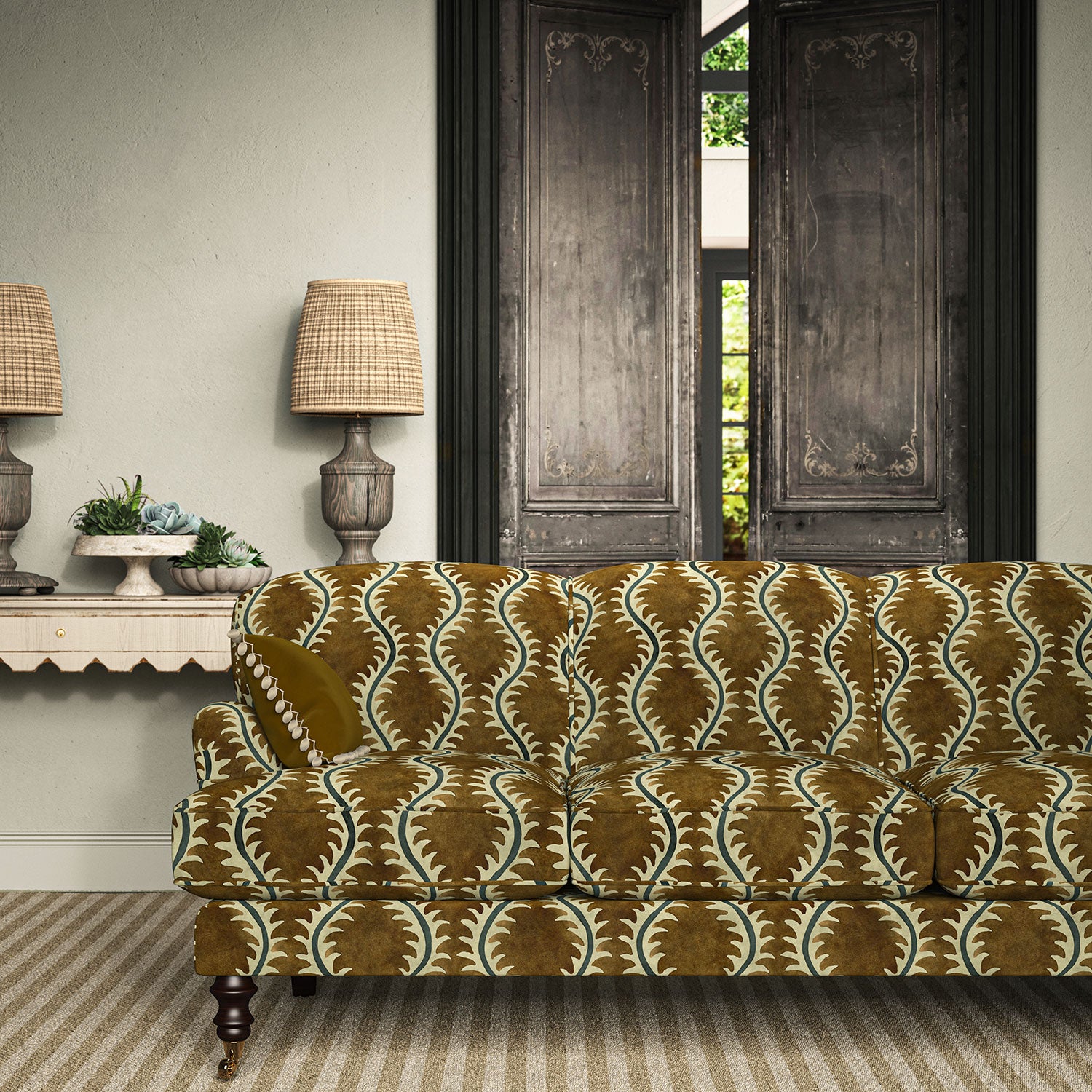 Sofa upholstered in a printed velvet fabric in brown and green featuring a stylized fern pattern.