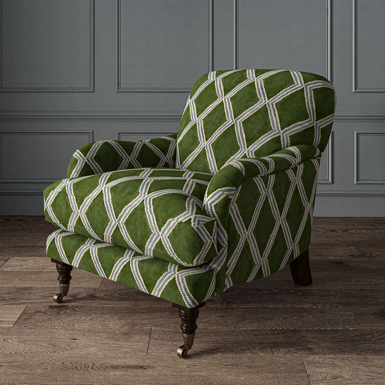 Accent chair upholstered in green and blue printed velvet with an irregular diamond pattern, showcasing the fabric’s rich texture. 