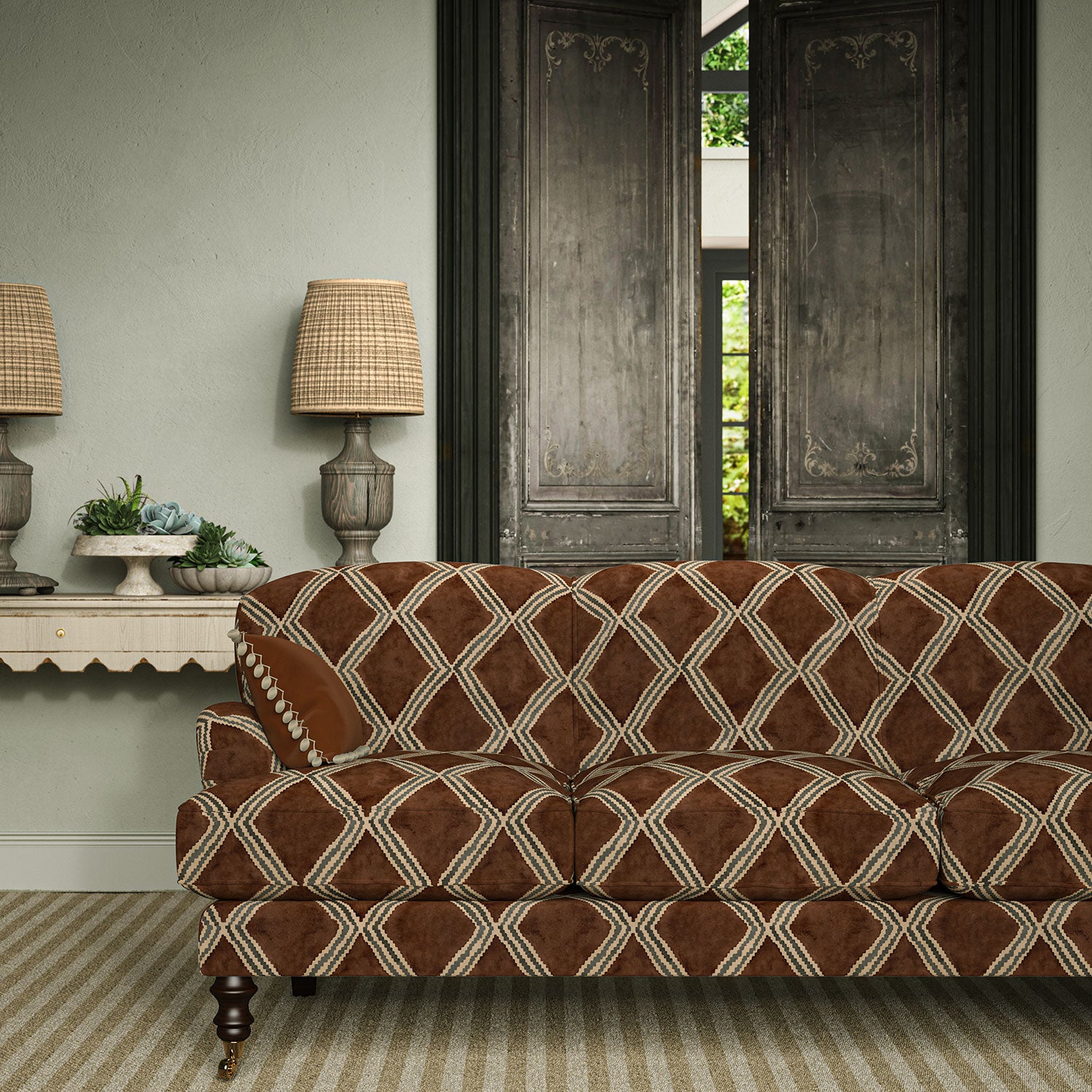 Velvet sofa covered in a brown and blue irregular diamond motif fabric