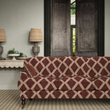 Sofa upholstered in plum printed velvet featuring an irregular diamond motif, styled in a timeless living room.
