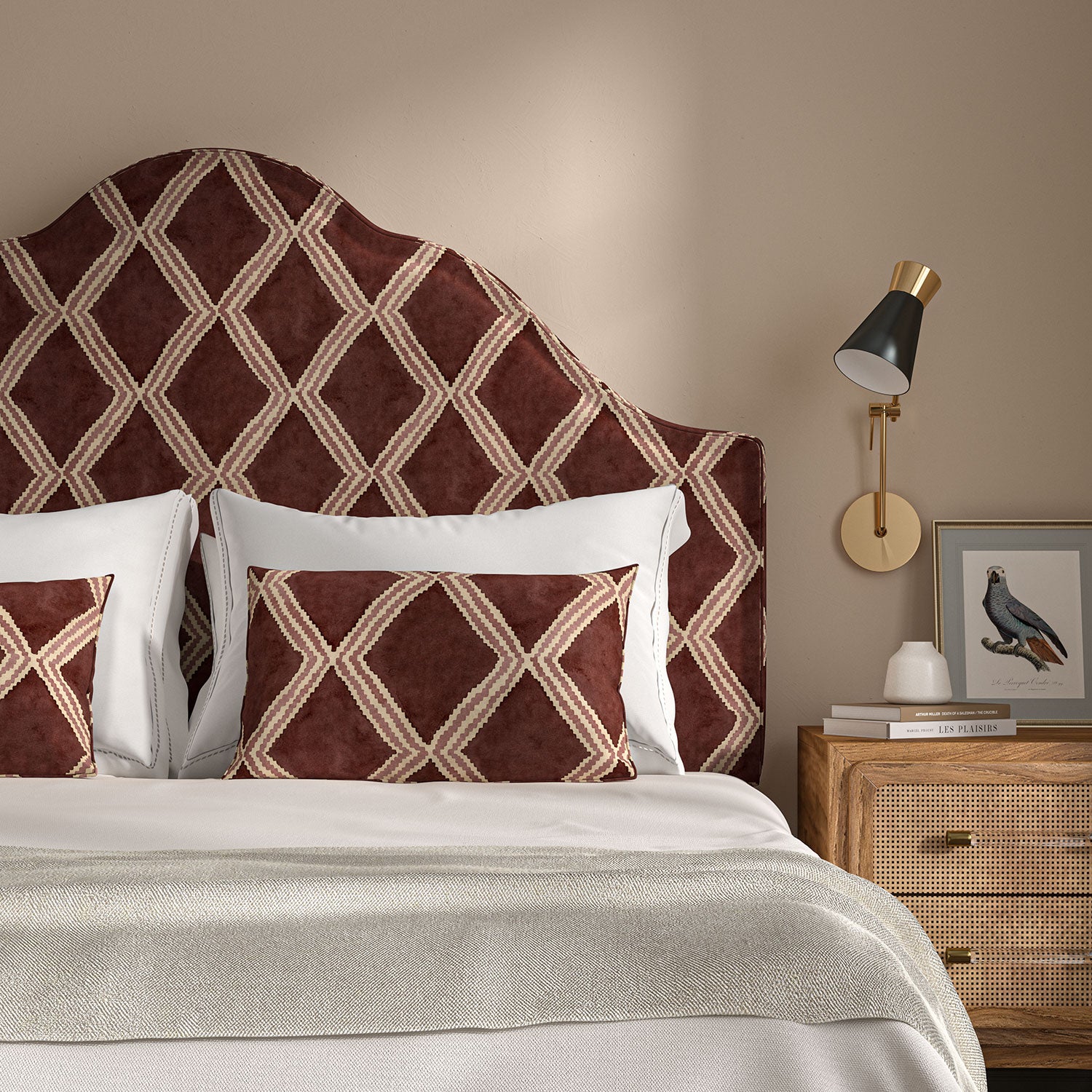 Bedroom with a curved upholstered headboard covered in plum printed velvet featuring an irregular diamond motif.