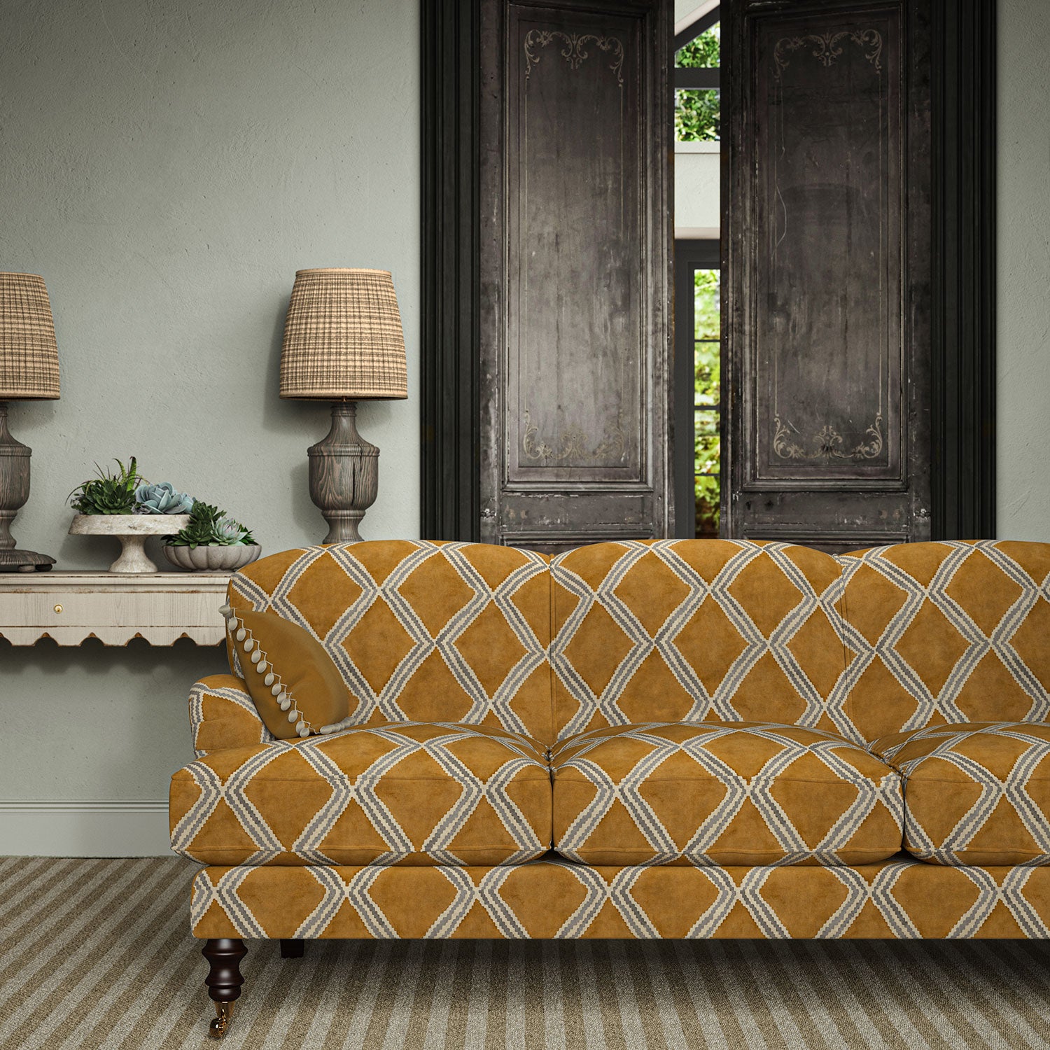 Sofa upholstered in brown and blue printed velvet featuring an irregular diamond motif, styled in a timeless living room.