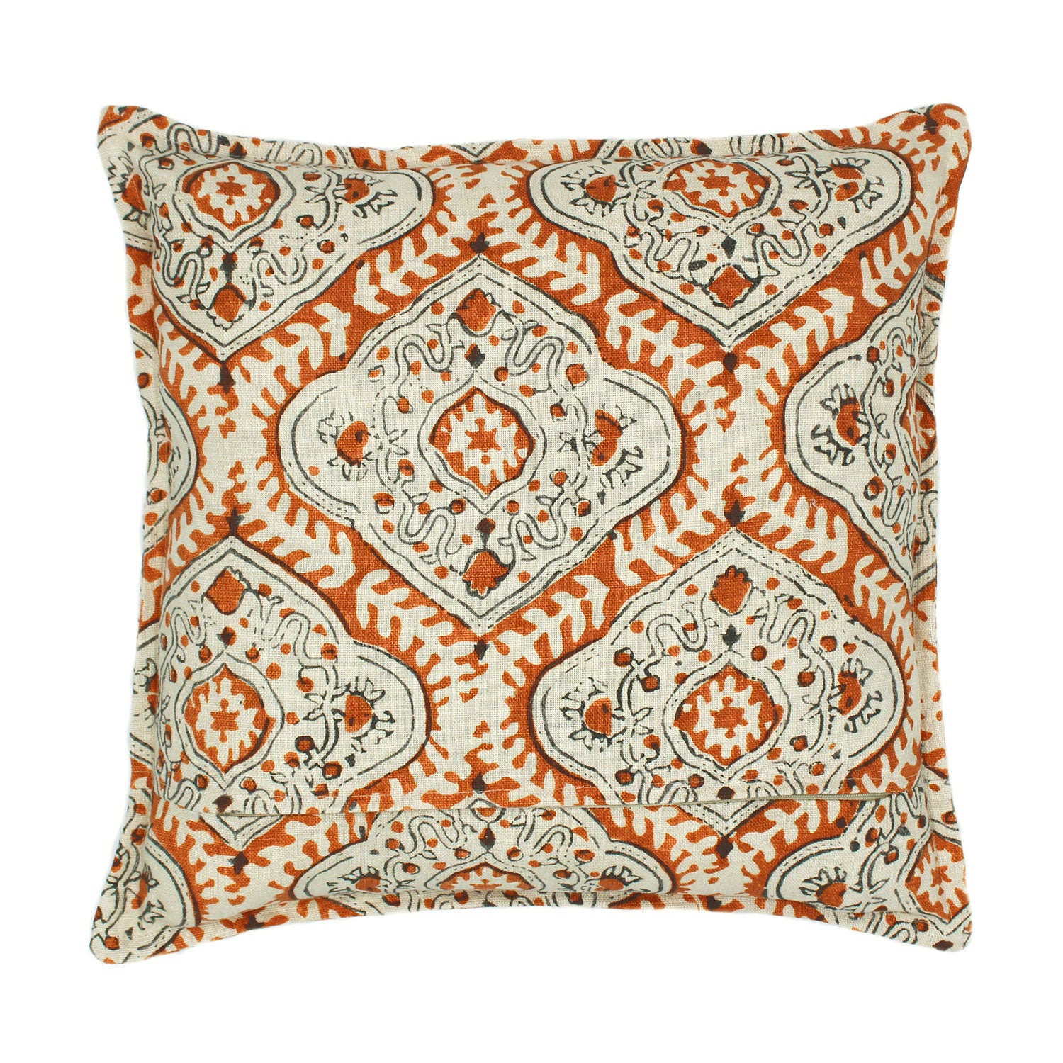 A orange, cream and black linen cushion with a central motif pattern.