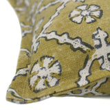 A yellow and cream linen cushion with a traditional Uzbekistan hand block prints pattern.