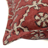 A red and cream linen cushion with a traditional Uzbekistan hand block prints pattern.