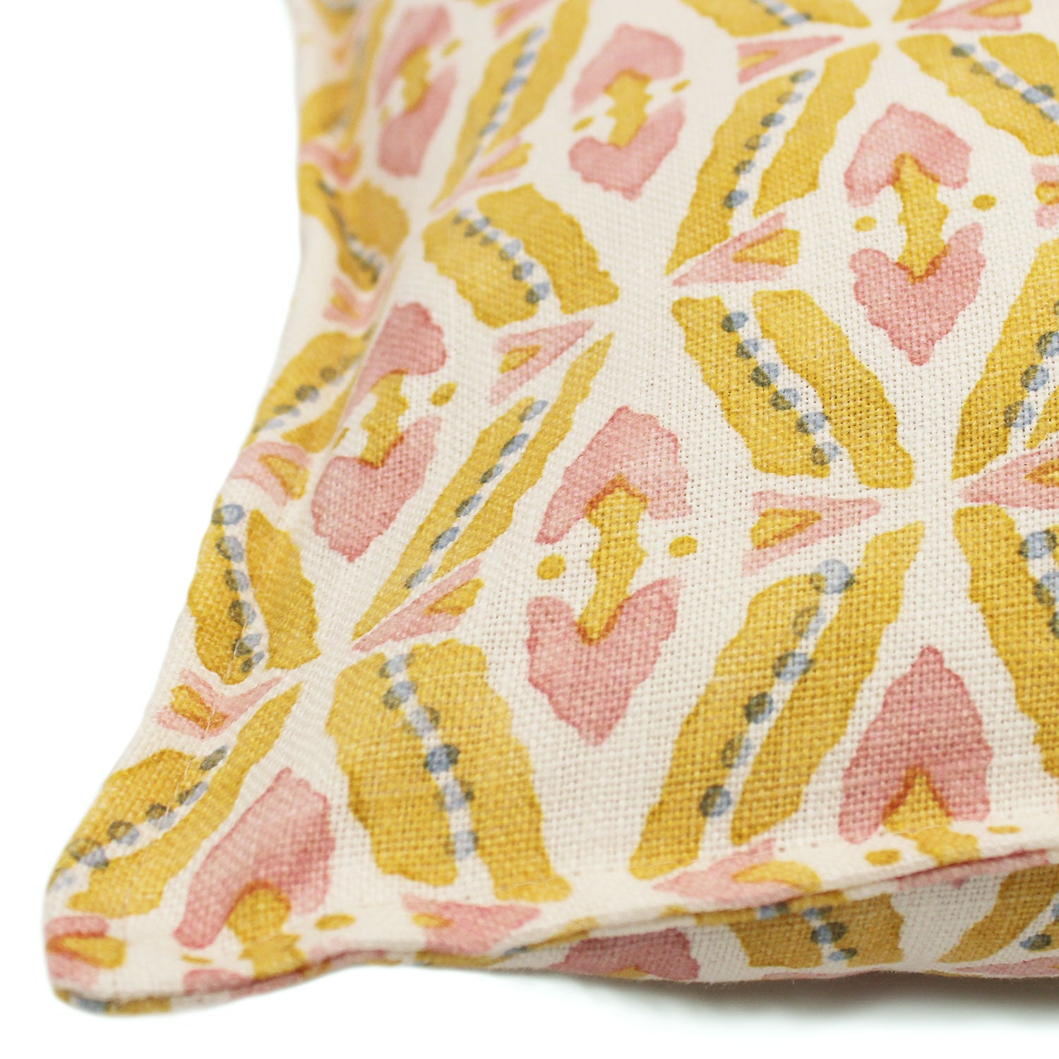 A multicoloured linen cushion with a geometric pattern.
