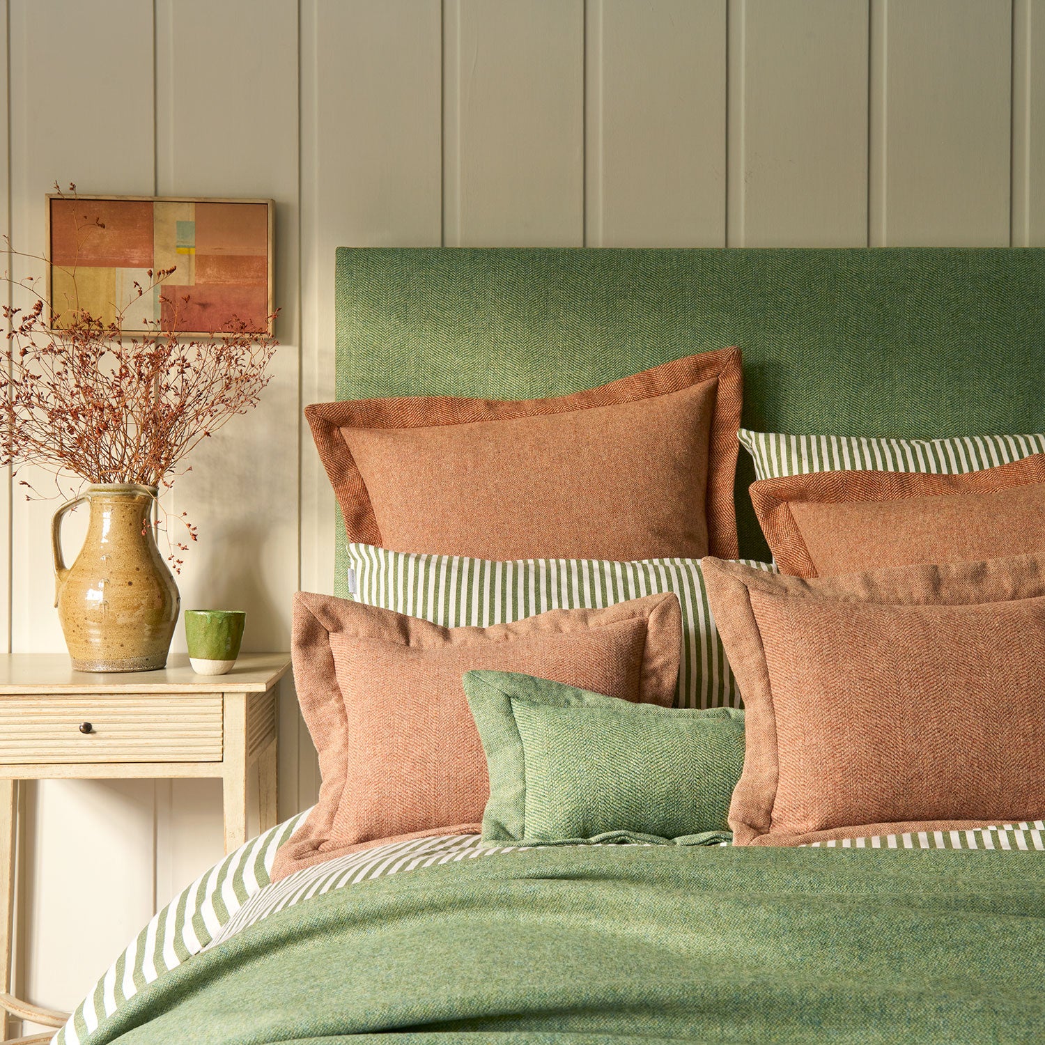 Cushions in a classic herringbone woven fabric in orange.