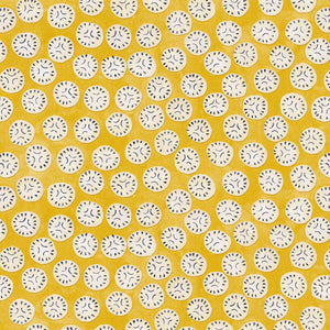 A linen printed with a subtle all-over repeat in yellow, cream and black