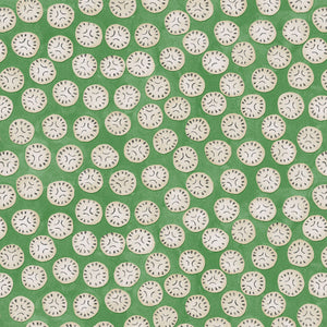 A linen printed with a subtle all-over repeat in green, cream and black