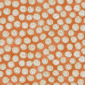 A linen printed with a subtle all-over repeat in orange, cream and black