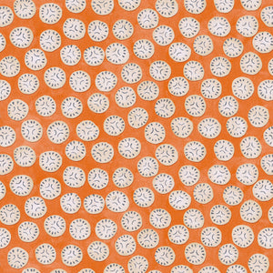 A linen printed with a subtle all-over repeat in orange, cream and black