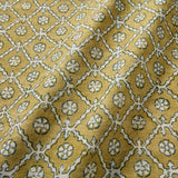 Linen fabric with a hand block-style pattern in yellow, black and cream