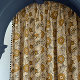 Stylised floral linen curtain in orange, black and cream
