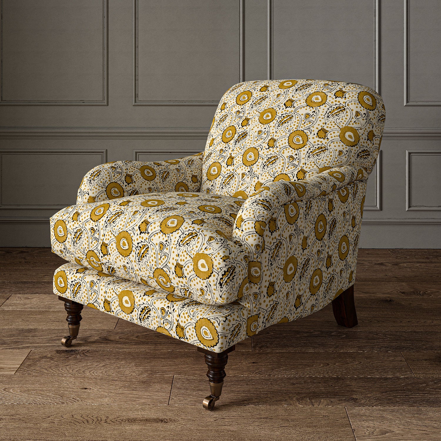 Armchair covered with a stylised floral printed on linen fabric in orange, black and cream