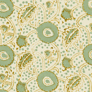 A stylised floral printed on linen fabric in green, orange and cream